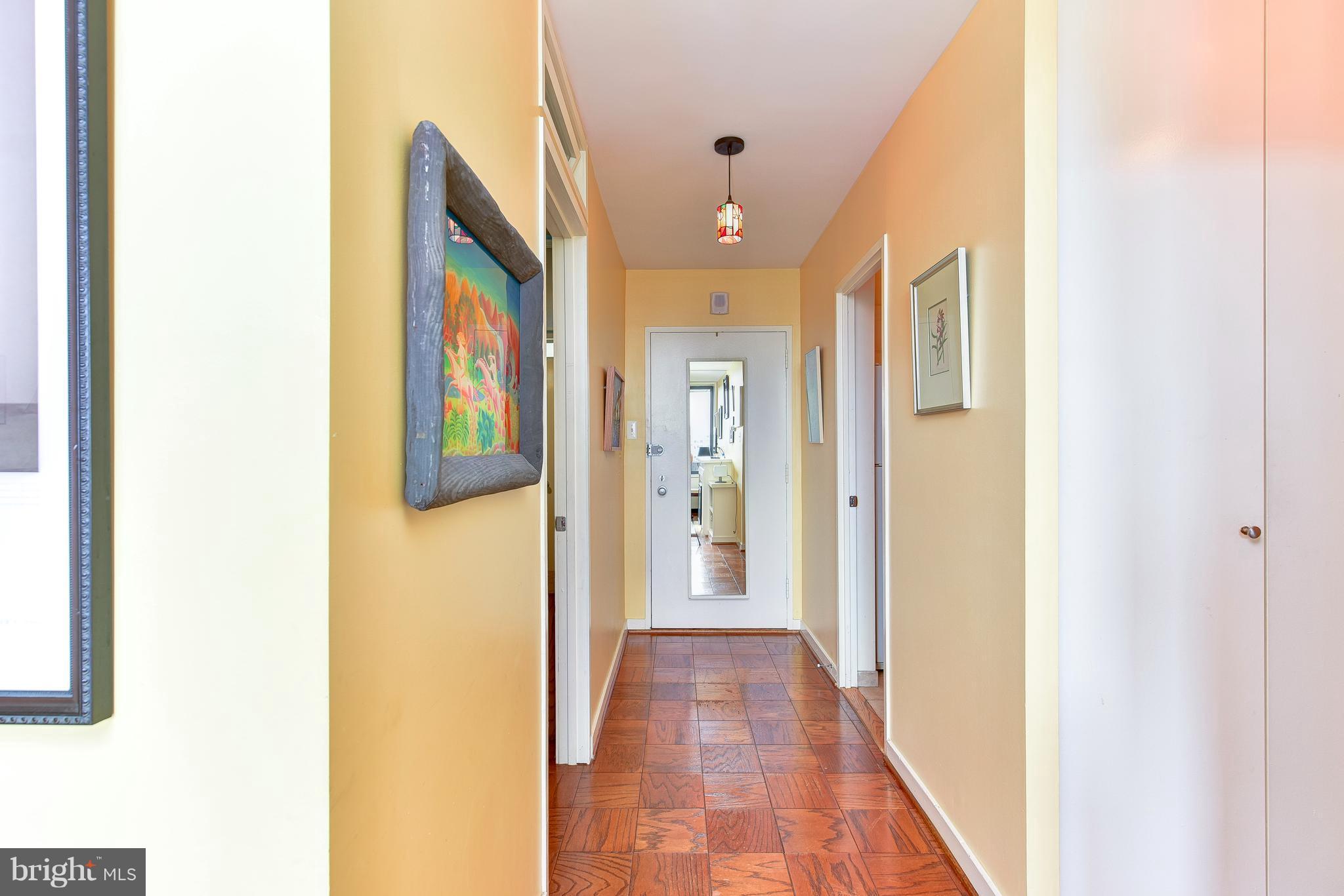 1245 4th Street Southwest, Unit E607 Washington, DC 20024 - Photo 14 of 24 a view of a hallway with wooden floor