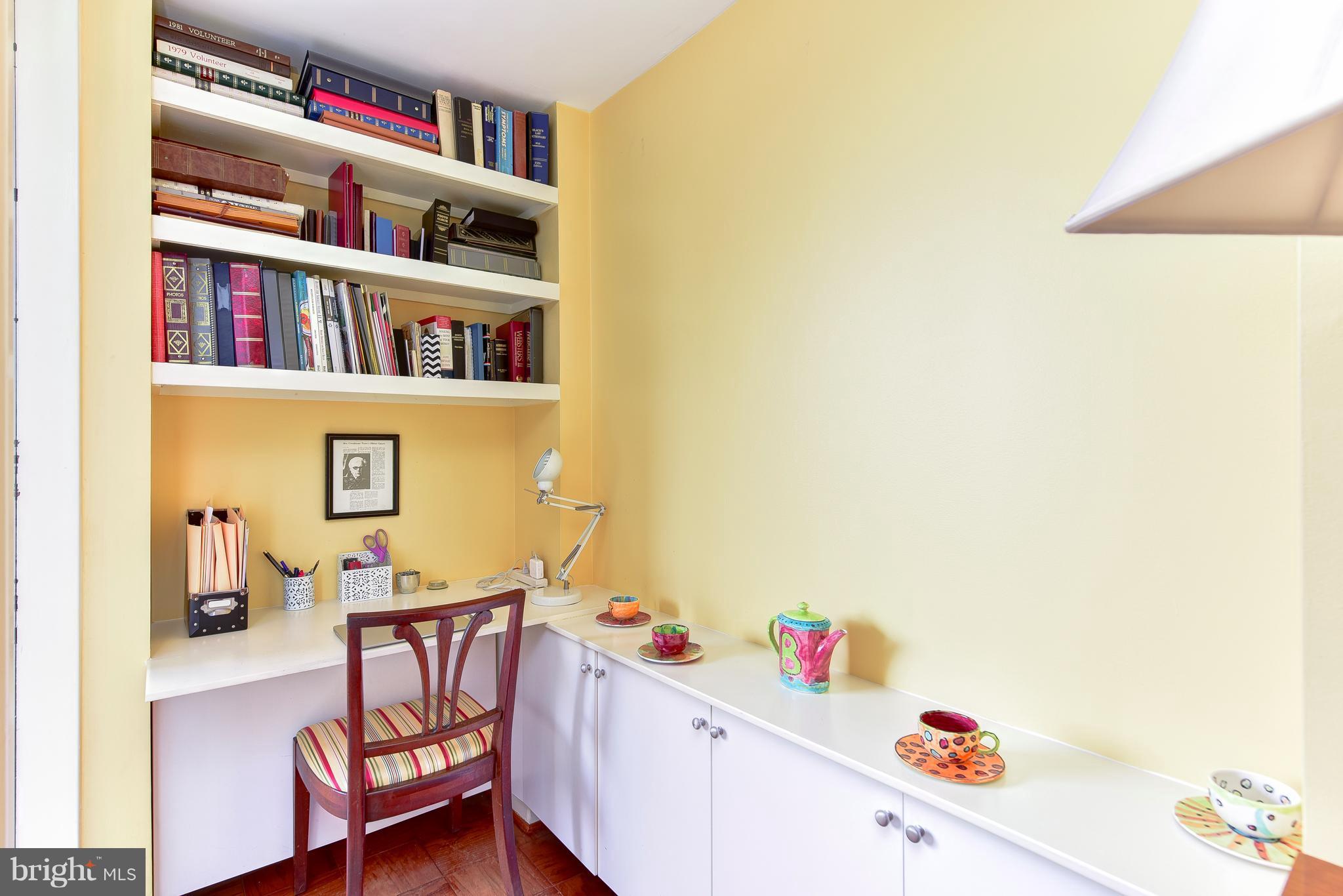 1245 4th Street Southwest, Unit E607 Washington, DC 20024 - Photo 15 of 24 a room with furniture and a book shelf