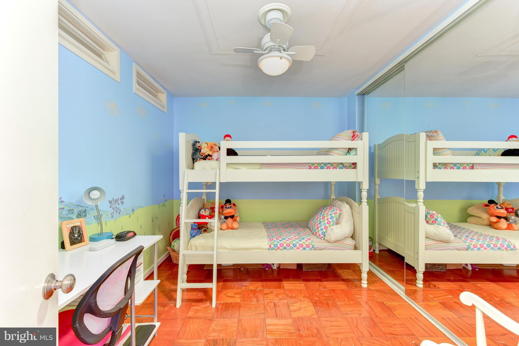 1245 4th Street Southwest, Unit E607 Washington, DC 20024 - Photo 23 of 24 a bedroom with a bed and closet