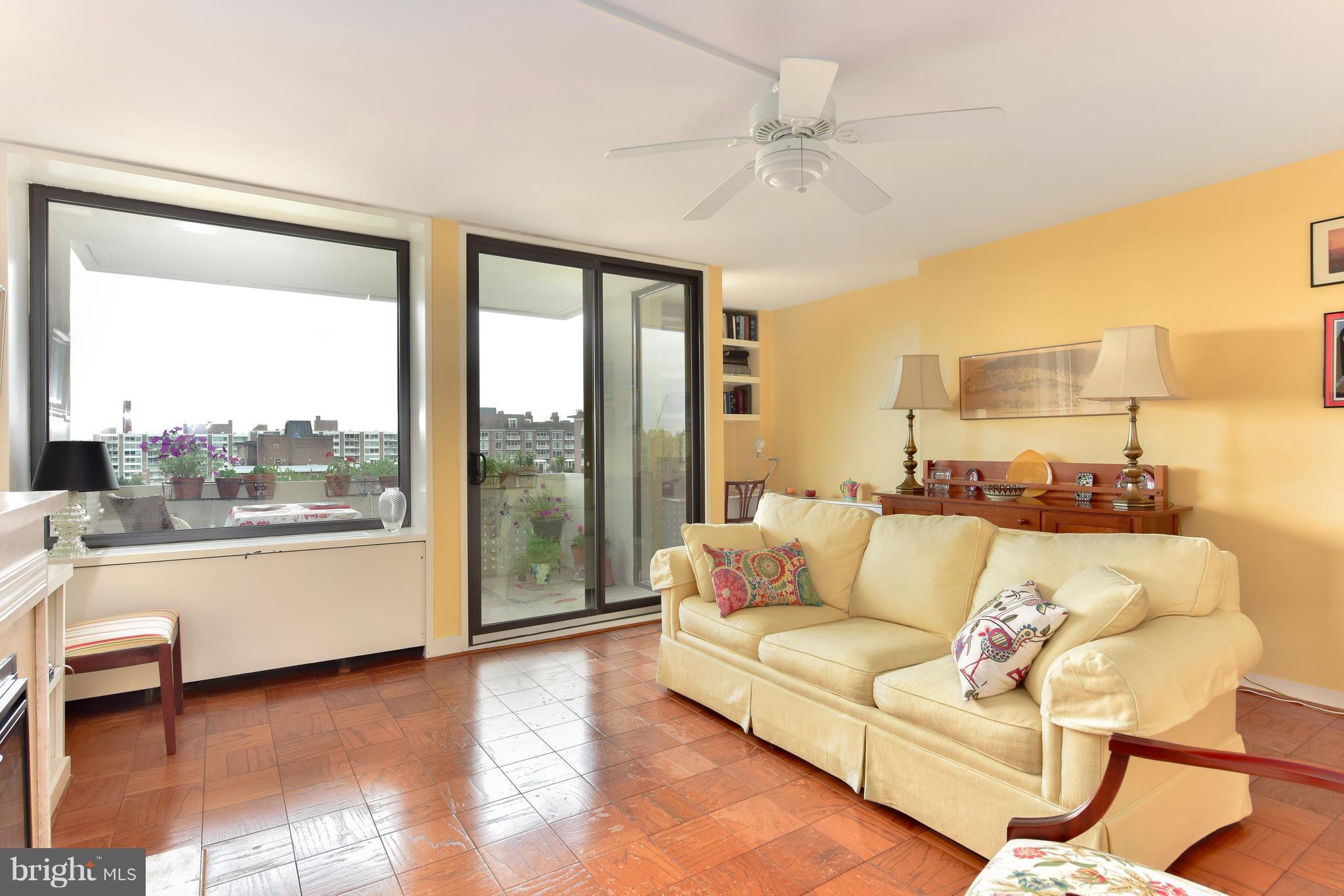 1245 4th Street Southwest, Unit E607 Washington, DC 20024 - Photo 6 of 24 a living room with furniture and a large window