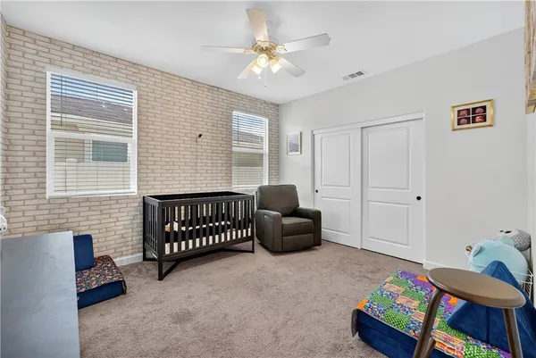 a bedroom with furniture and a window