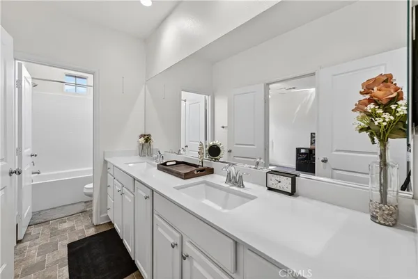 a kitchen with a sink a stove and cabinets