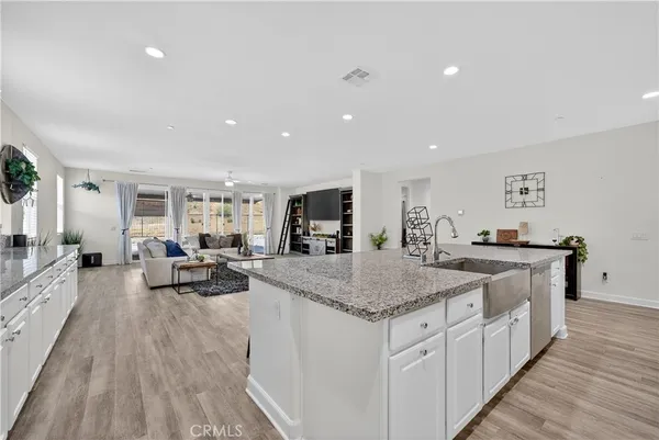 a kitchen with sink stove and center island