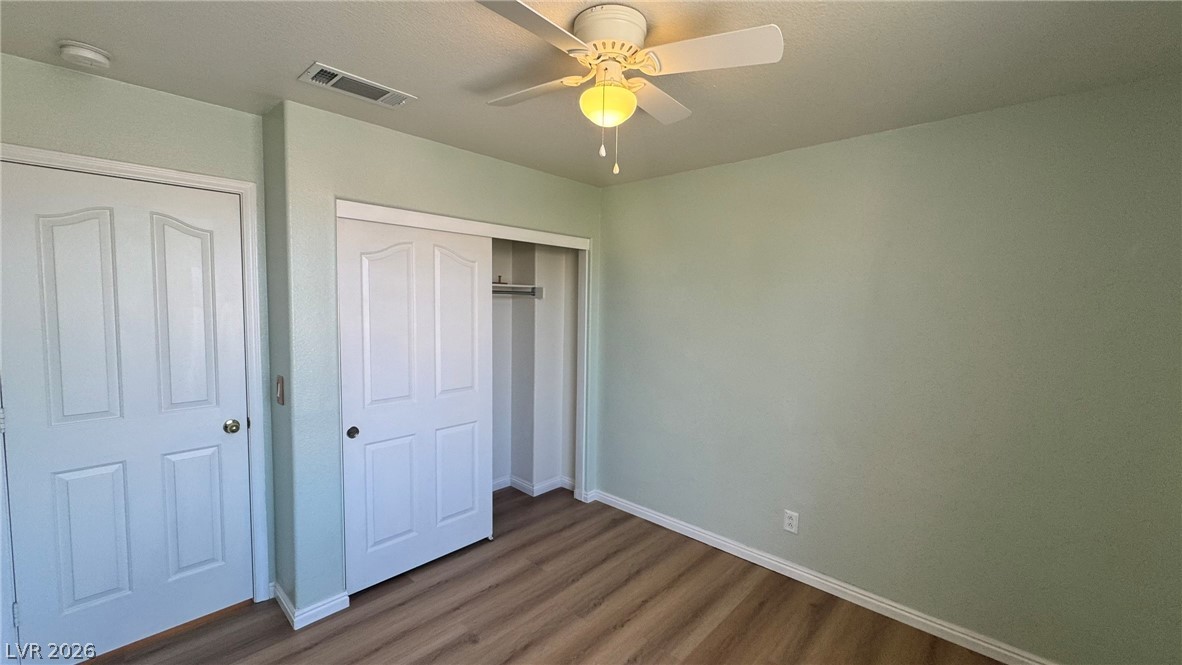 9716 Ridge Creek Place Las Vegas, NV 89134 - Photo 16 of 28 This cozy bedroom features durable flooring and a convenient closet, perfect for comfortable living.