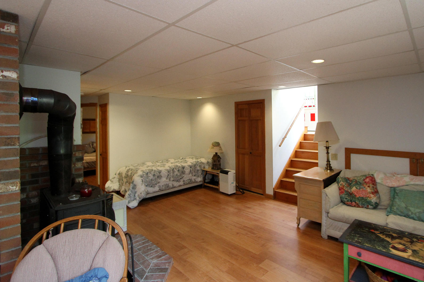 515 Steele Road Eastham, MA 02642 - Photo 17 of 33 ground level room with wood stove