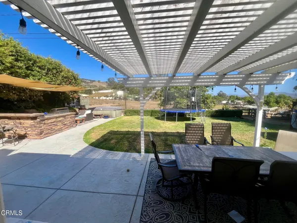 a view of a swimming pool with a patio