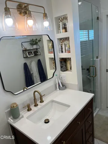a bathroom with a sink and a mirror