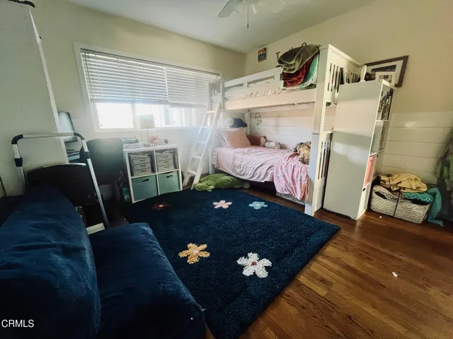 a bed room with a bed furniture and a window