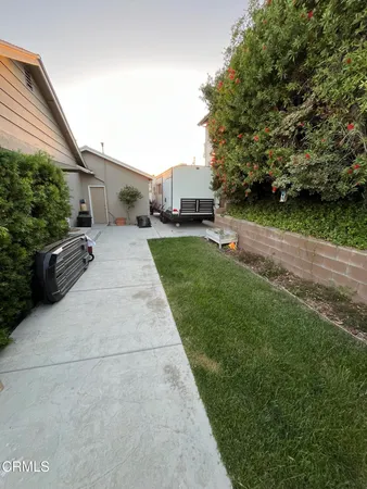 a view of a back yard of the house
