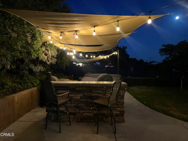 a view of a chairs and table in the patio