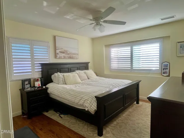 a bedroom with a bed and a table in it