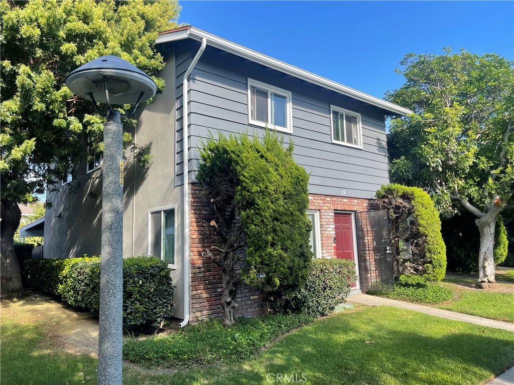 1777 Mitchell Avenue, Unit 29 Tustin, CA 92780 - Photo 1 of 26 a view of house with a yard
