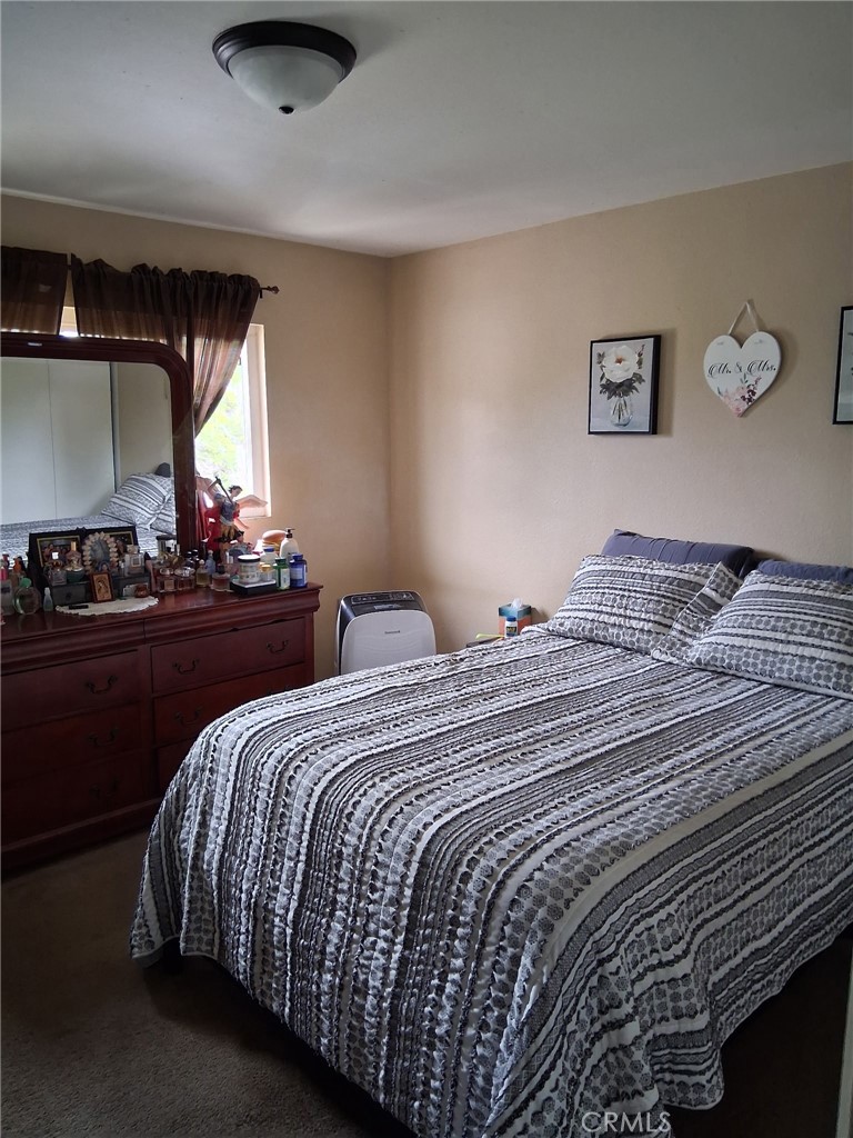 1777 Mitchell Avenue, Unit 29 Tustin, CA 92780 - Photo 14 of 26 a bedroom with double bed and a window