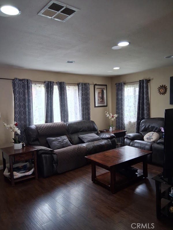 1777 Mitchell Avenue, Unit 29 Tustin, CA 92780 - Photo 18 of 26 a living room with furniture a large window and a dining table