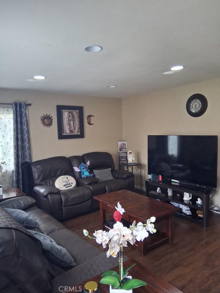 1777 Mitchell Avenue, Unit 29 Tustin, CA 92780 - Photo 19 of 26 a living room with furniture potted plant and a flat screen tv