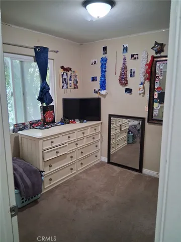 a view of a workspace with furniture and cabinet