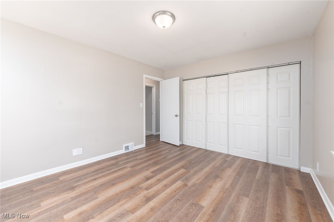 370 South Green Road Cleveland, OH 44121 - Photo 14 of 34 Unfurnished bedroom featuring a closet and light hardwood / wood-style flooring