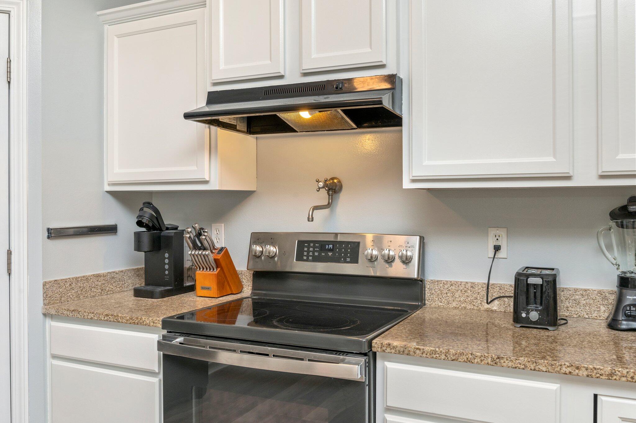 6082 Robin Road Crestview, FL 32539 - Photo 15 of 45 a kitchen with granite countertop a sink and cabinets