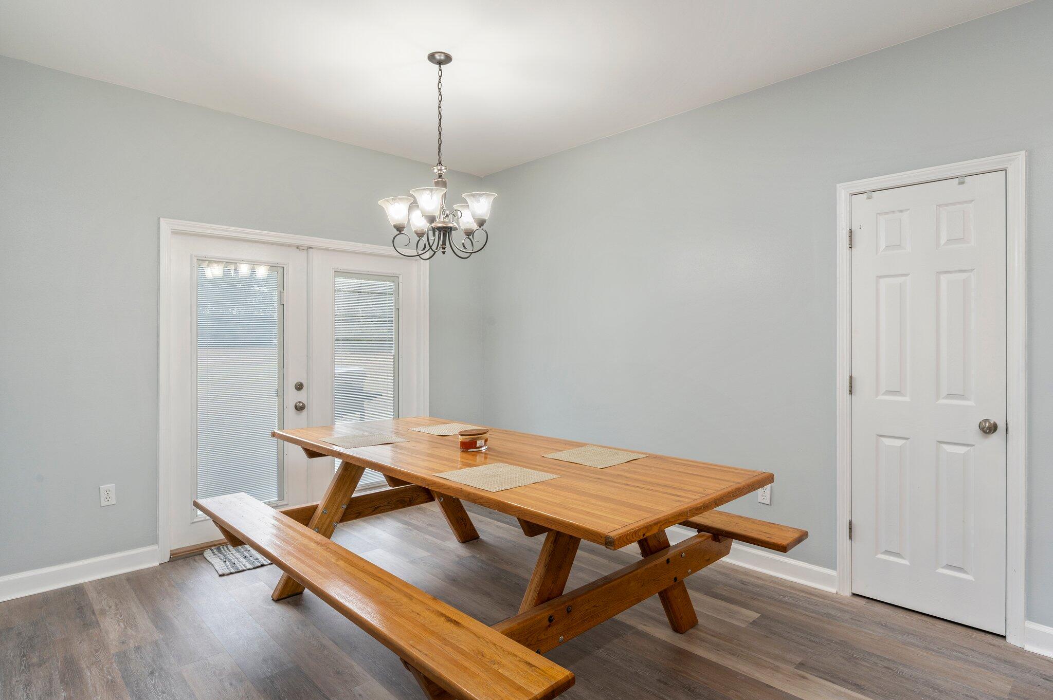 6082 Robin Road Crestview, FL 32539 - Photo 17 of 45 a room with table chairs and wooden floor