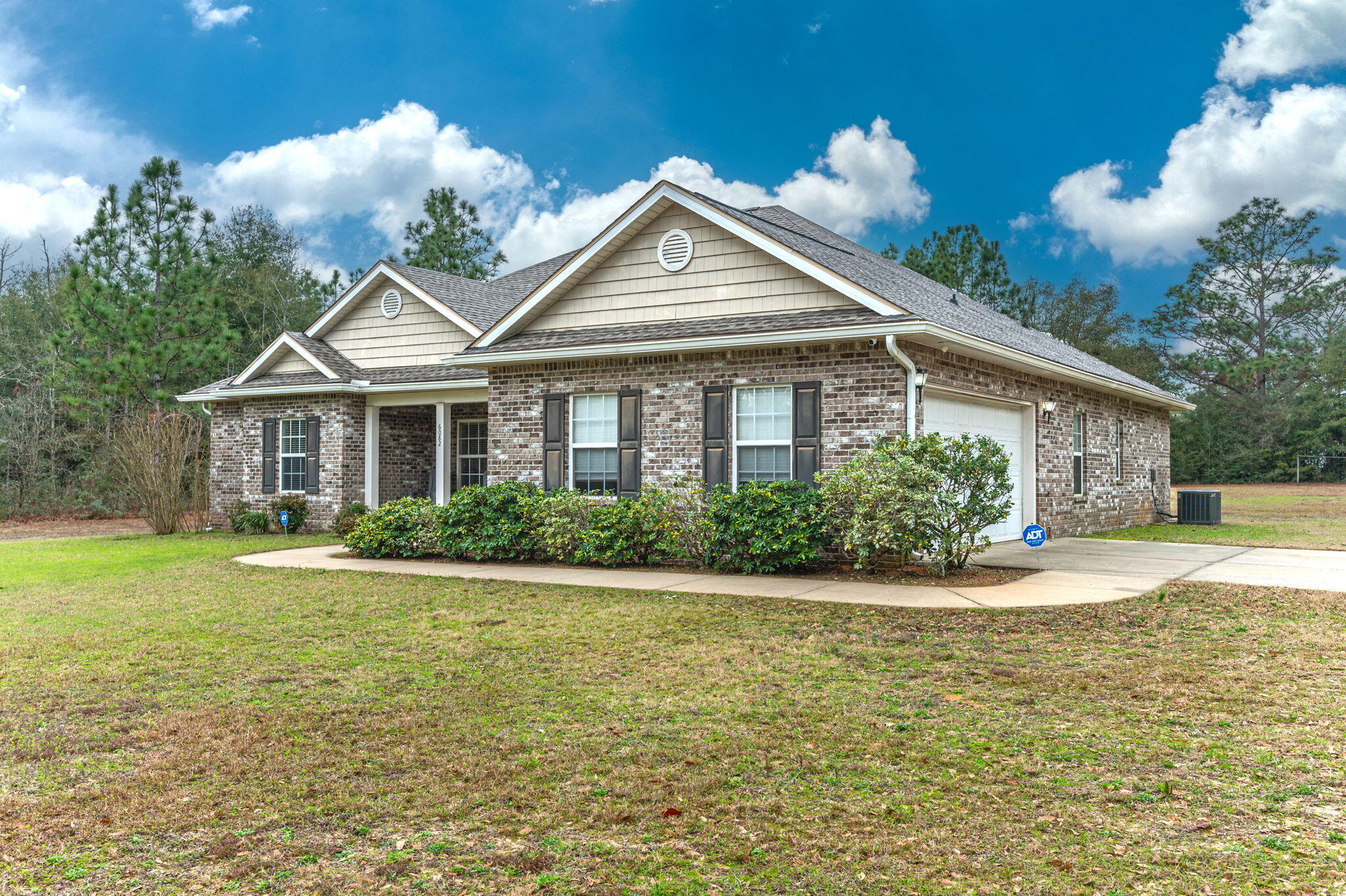 6082 Robin Road Crestview, FL 32539 - Photo 4 of 45 a front view of a house with a yard