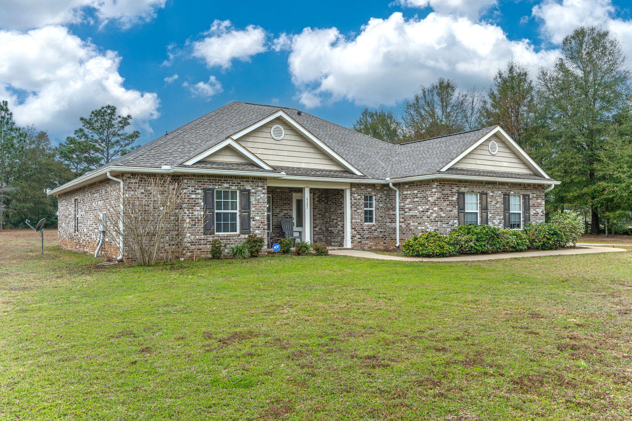 6082 Robin Road Crestview, FL 32539 - Photo 5 of 45 a front view of a house with a garden