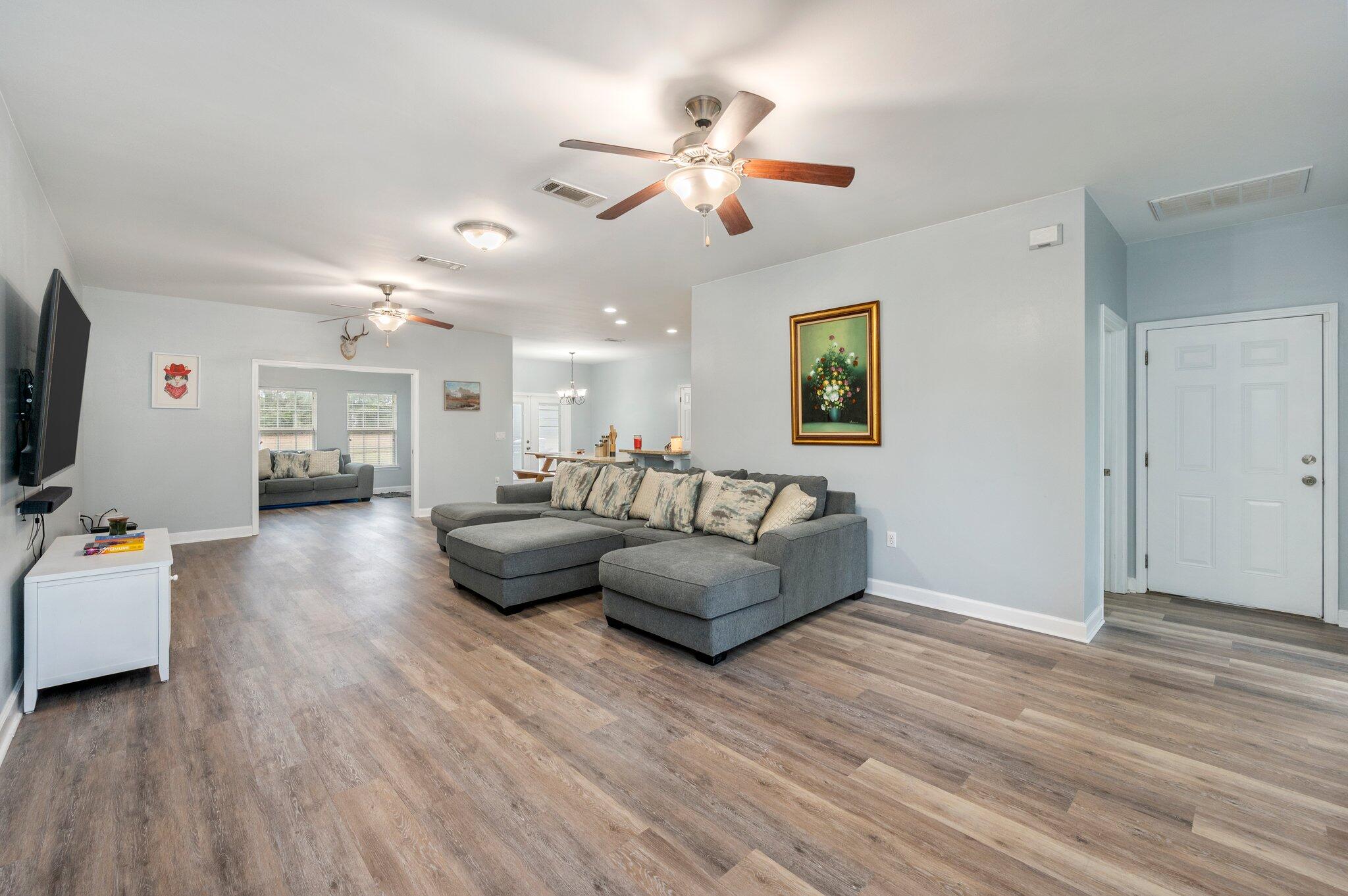 6082 Robin Road Crestview, FL 32539 - Photo 8 of 45 a living room with furniture and wooden floor