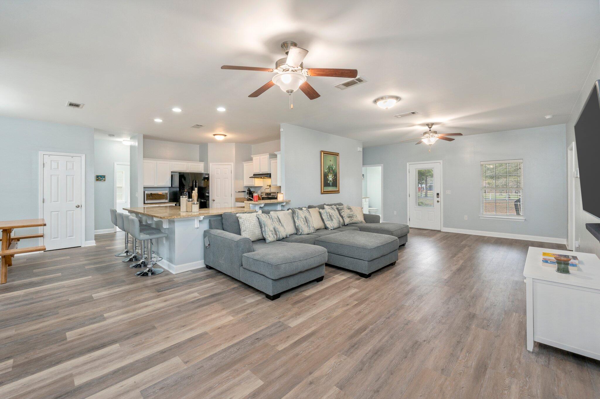 6082 Robin Road Crestview, FL 32539 - Photo 10 of 45 a living room with furniture and a wooden floor