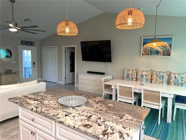a kitchen with a stove a sink and a refrigerator