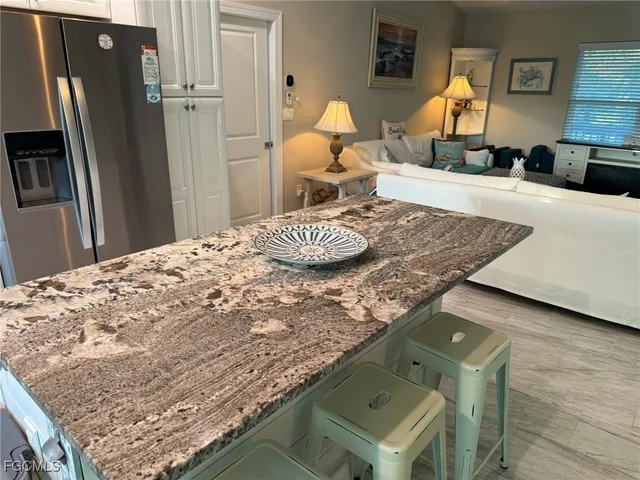 a bedroom with two beds and a window