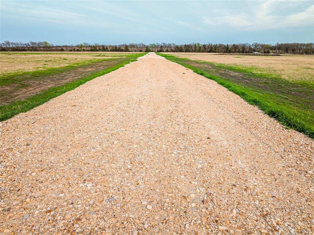 Lot 15 Farm Road Blossom, TX 75416 - Photo 5 of 5 a view of an ocean with a large bridge