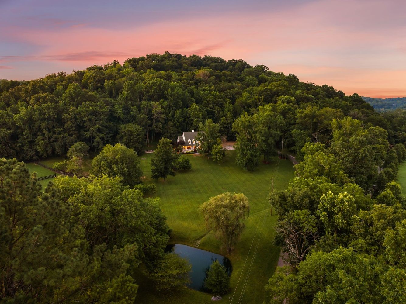 9581 South Harpeth Road Nashville, TN 37221 - Photo 2 of 55 a view of a lake with a mountain in the background