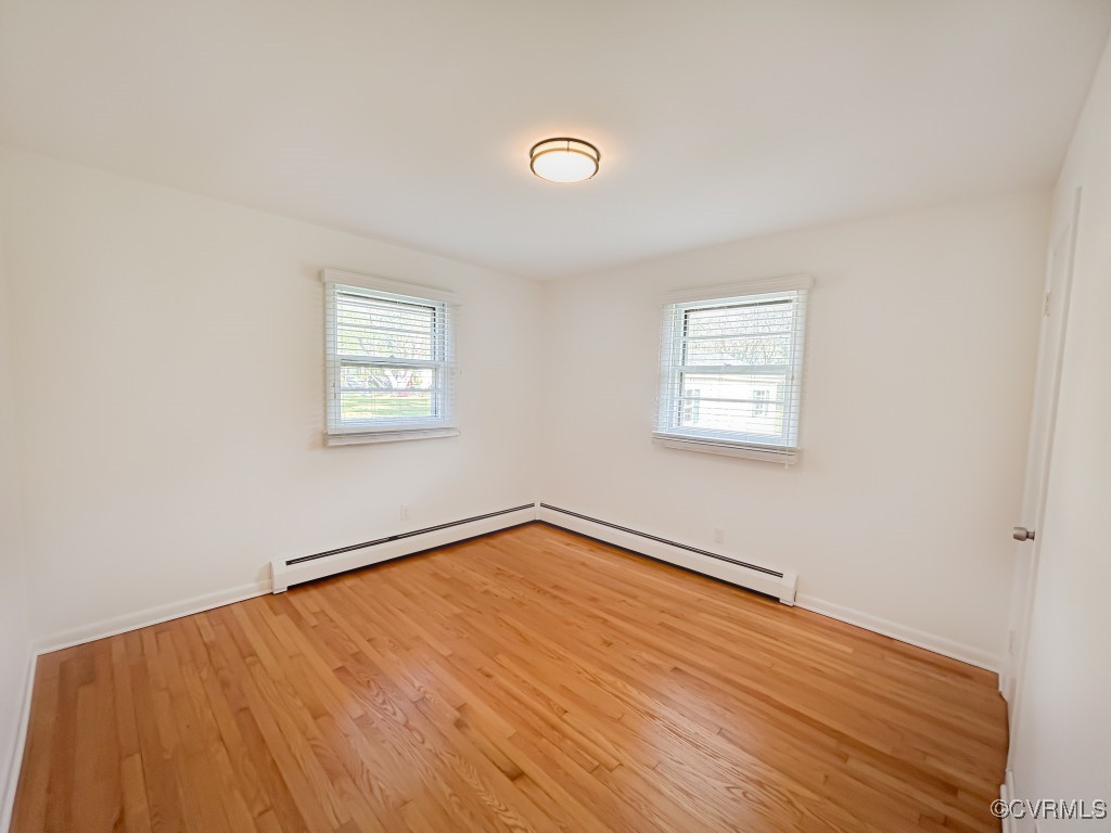 2721 Perlock Road Richmond, VA 23237 - Photo 12 of 27 Empty room with a wealth of natural light, baseboa
