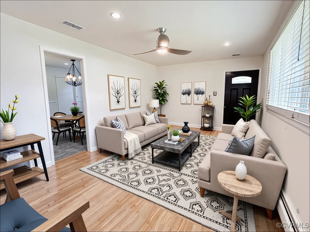 2721 Perlock Road Richmond, VA 23237 - Photo 18 of 27 Living room with visible vents, baseboard heating,