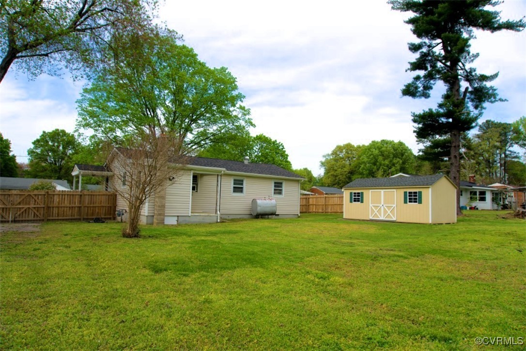 2721 Perlock Road Richmond, VA 23237 - Photo 22 of 27 View of yard featuring heating fuel, a storage she