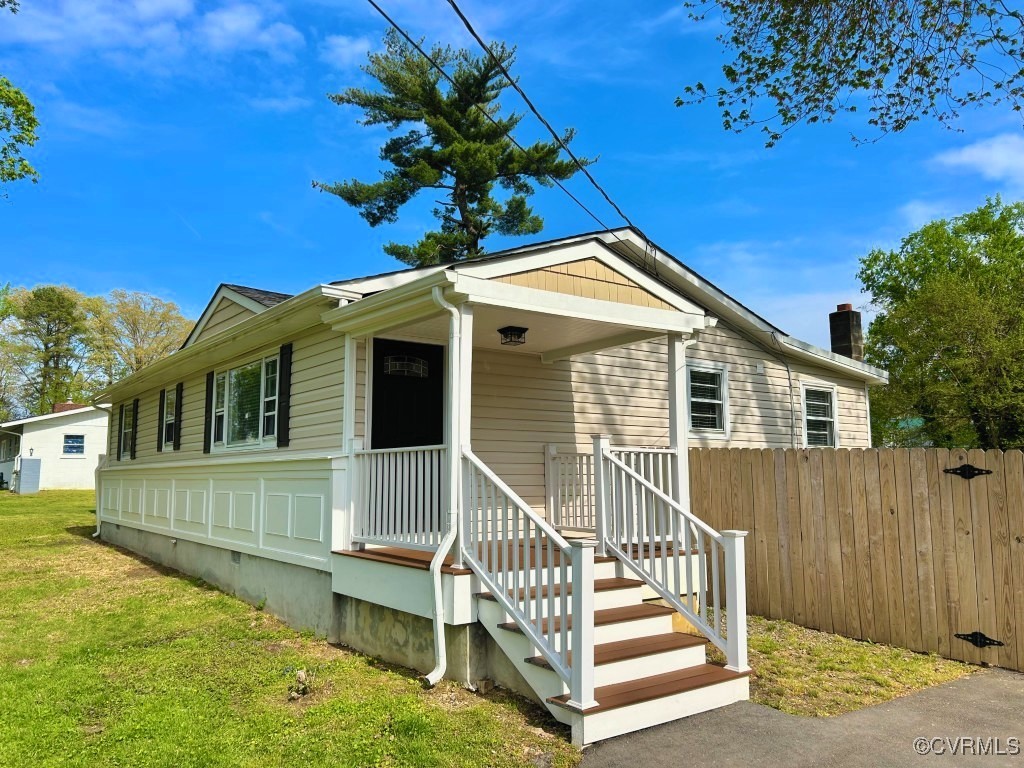 2721 Perlock Road Richmond, VA 23237 - Photo 27 of 27 View of front of house featuring a front yard and