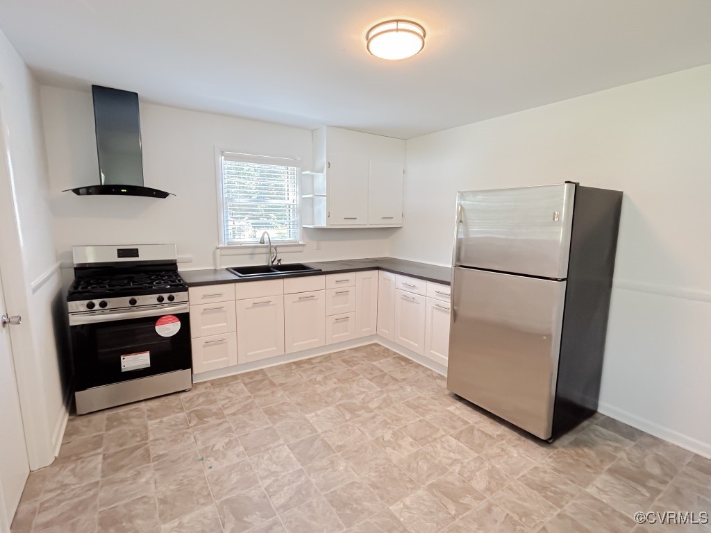 2721 Perlock Road Richmond, VA 23237 - Photo 4 of 27 Kitchen with wall chimney range hood, dark counter