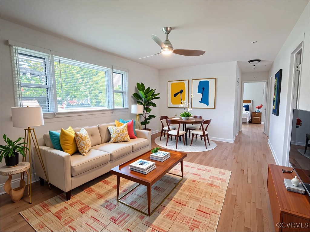 2721 Perlock Road Richmond, VA 23237 - Photo 8 of 27 Living area with baseboards, light wood-style floo