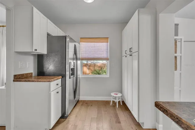 a living room with furniture cabinets and a flat screen tv