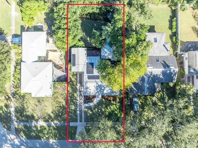 a view of a city with lush green forest