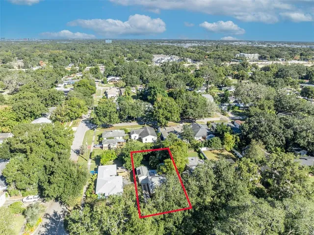 an aerial view of residential house with an outdoor space and street view