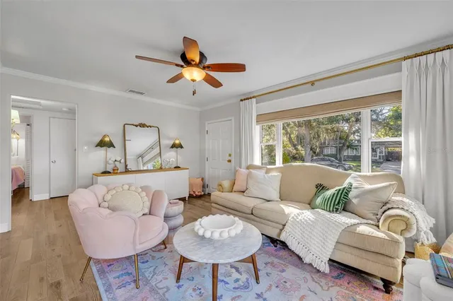 a kitchen with cabinets and wooden floor