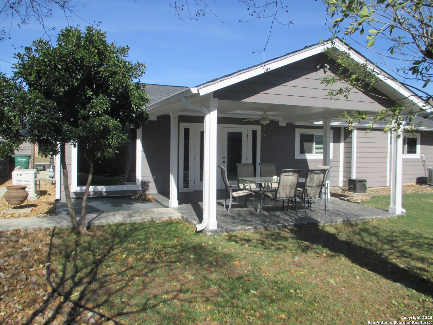 7126 Spring Flower Street San Antonio, TX 78249 - Photo 17 of 20 a view of a house with backyard porch and sitting area