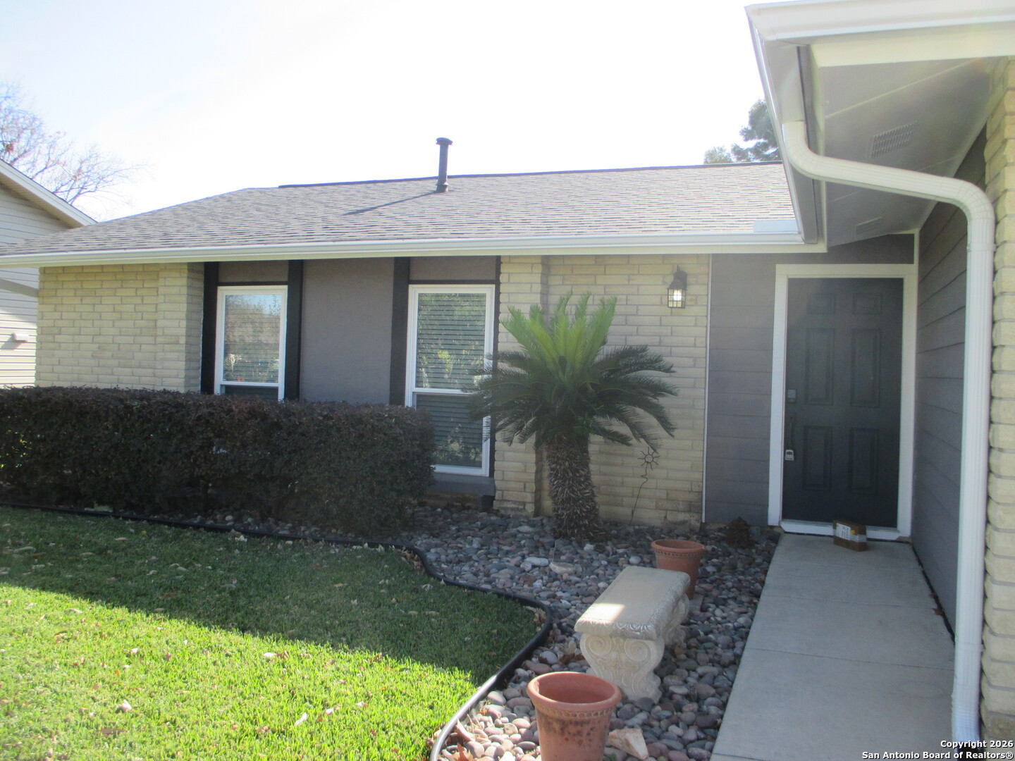 7126 Spring Flower Street San Antonio, TX 78249 - Photo 2 of 20 a front view of a house with garden