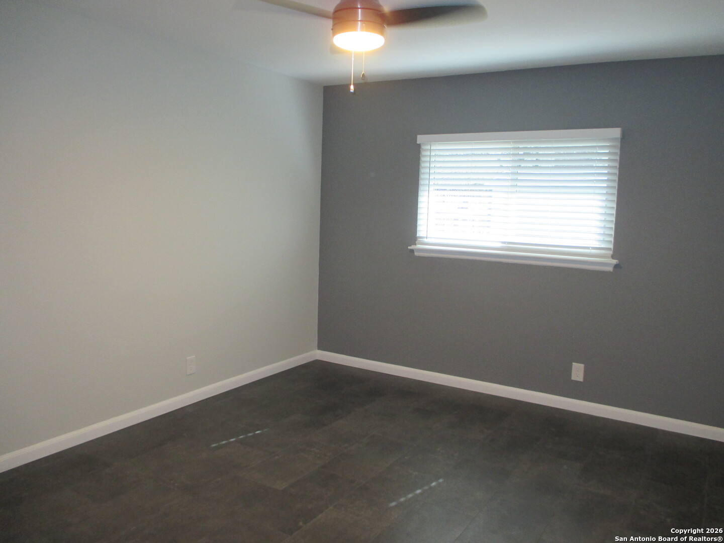7126 Spring Flower Street San Antonio, TX 78249 - Photo 8 of 20 an empty room with a window