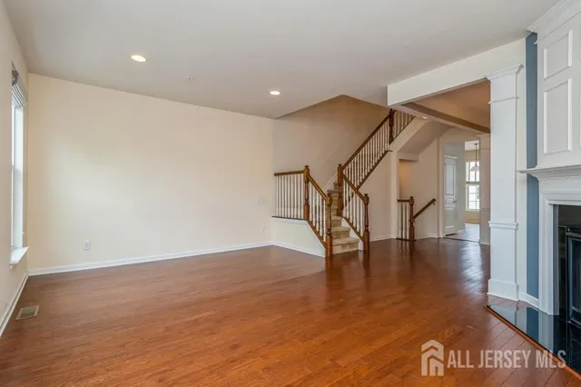 a view of an entryway with wooden floor