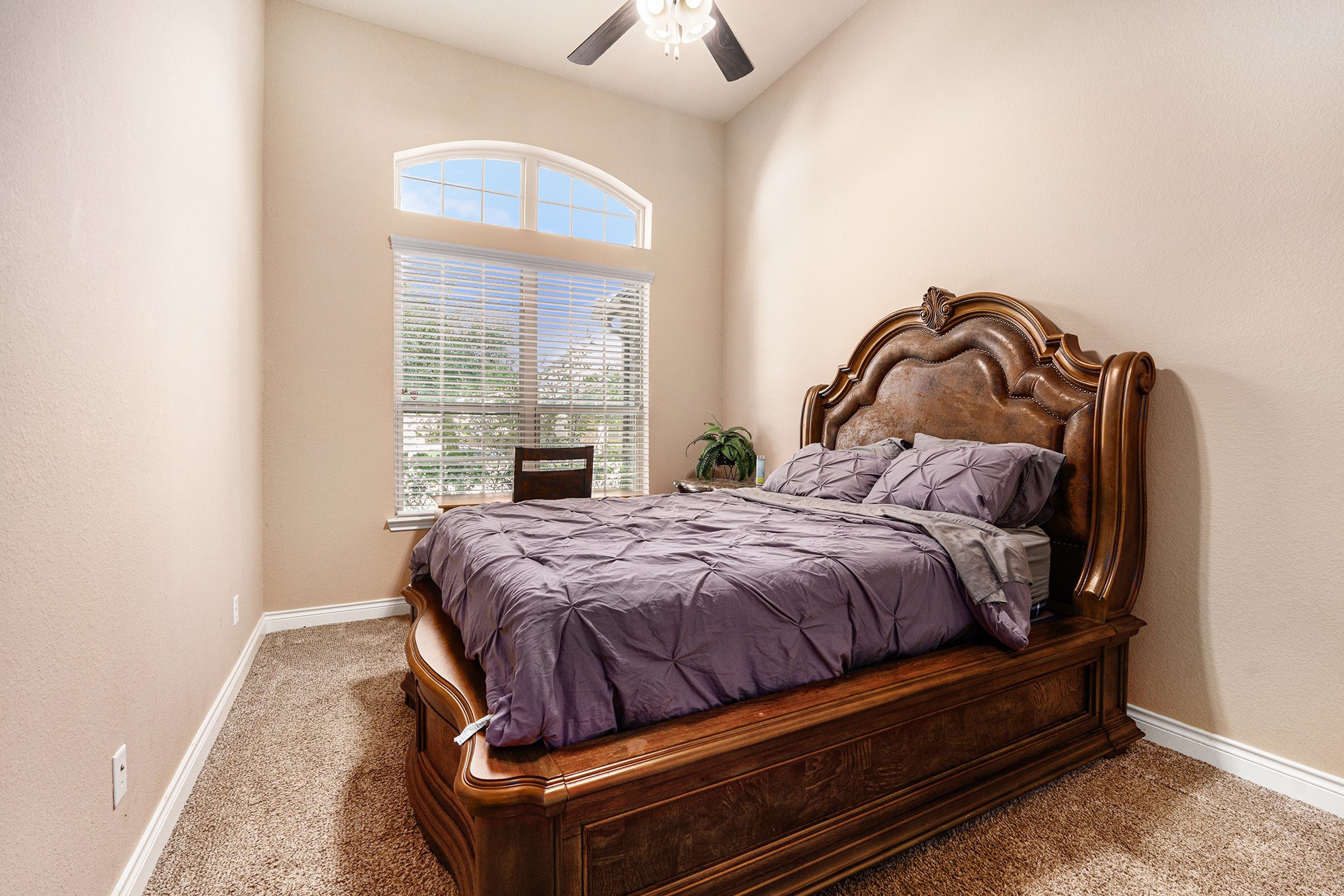 9039 Centennial Drive Conroe, TX 77384 - Photo 8 of 16 a bedroom with a bed and window