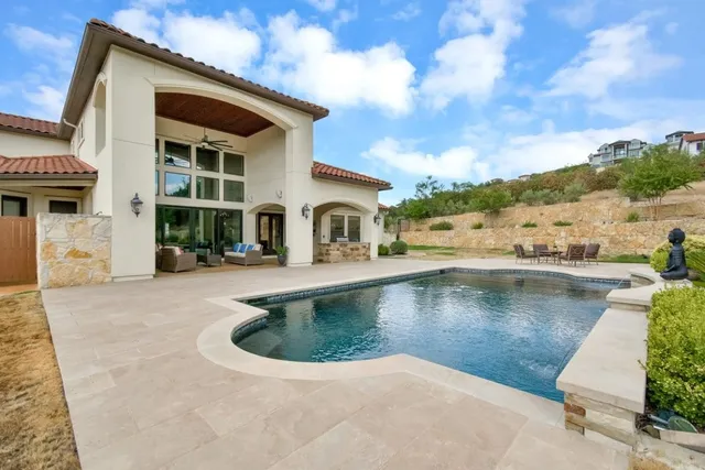 a view of a swimming pool with a patio