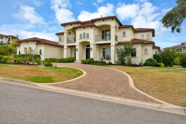 a view of white house with a swimming pool