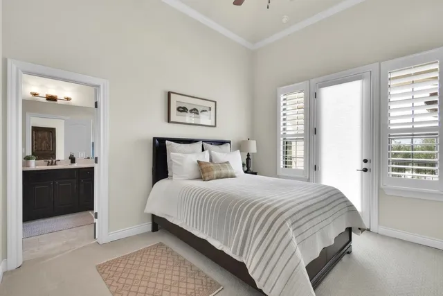 a bedroom with a bed and a couch