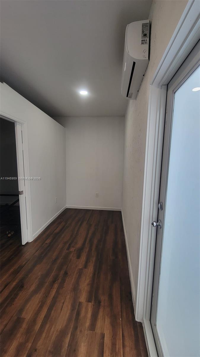 10172 Southwest 159th Avenue Miami, FL 33196 - Photo 5 of 10 a view of a hallway with wooden floor and staircase